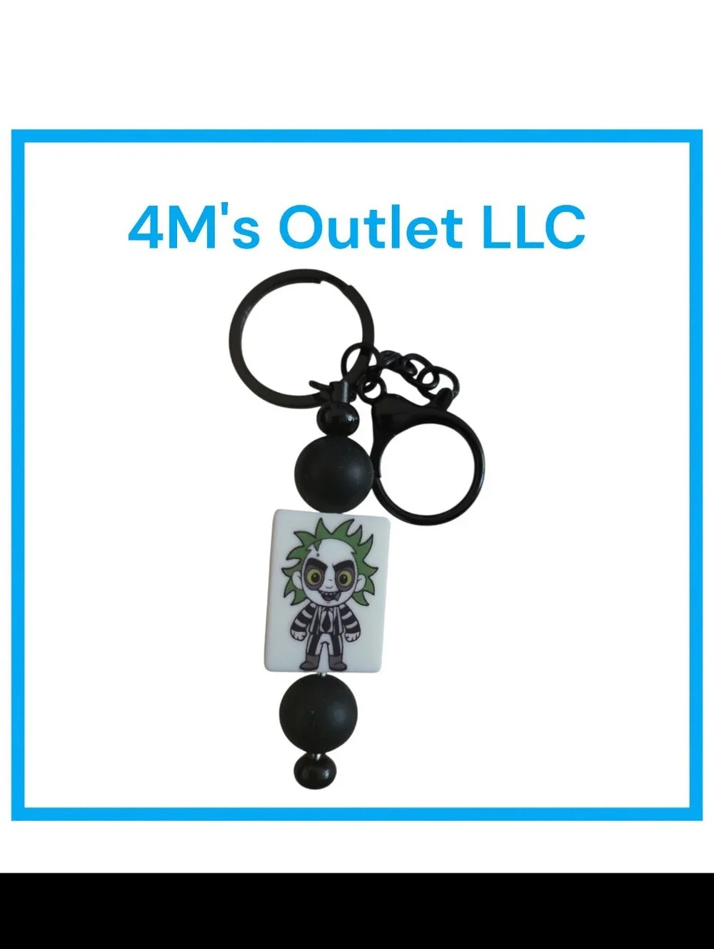 Source Unknown Black and White Character Keychain with Green Accent
